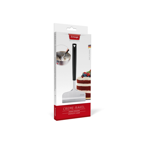 A boxed countertop cream scraper called Crème-Rakel by Triangle, shown in its retail packaging on a clean white background. The package is white with red panels and a photo of the black-and-silver scraper attached.