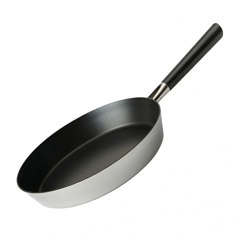 Black frying pan with a silver base on a white background