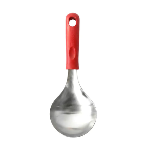Stainless steel serving spoon with a red handle on a white background