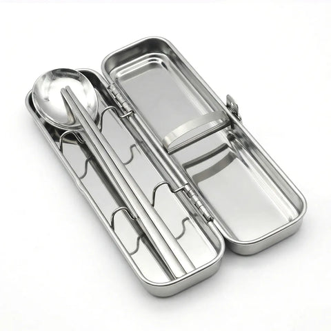 Stainless steel cutlery set in a case on a white background