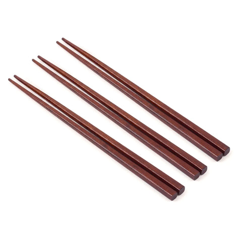 Set of wooden chopsticks on a white background