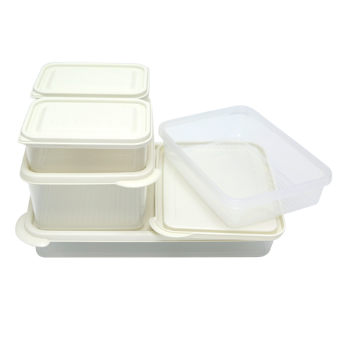 Set of white food storage containers with lids on a white background