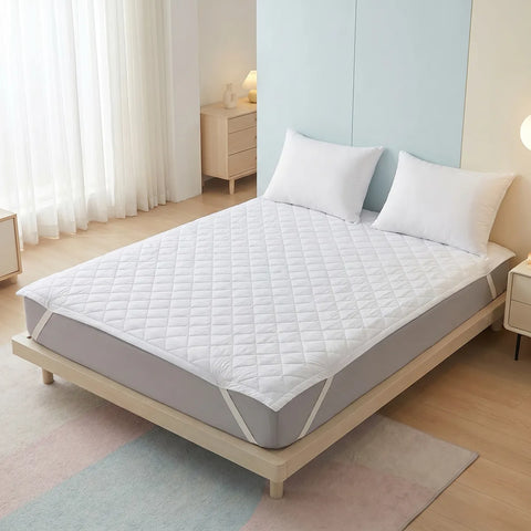 Mattress protector on a bed in a bedroom setting