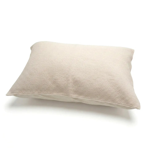 Beige pillow on a white background