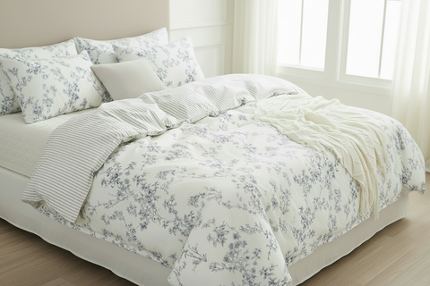 Floral bedding set on a bed in a bright bedroom