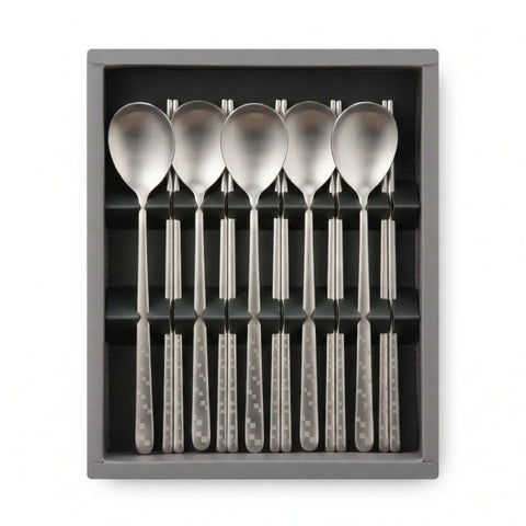 Set of six silver spoons and chopsticks in a gray box