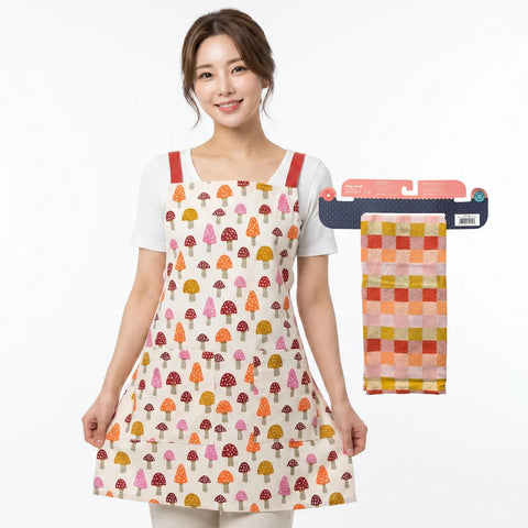 Woman wearing a colorful apron with a matching towel on a white background
