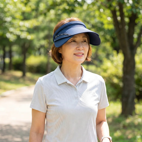 Woman wearing a blue visor outdoors