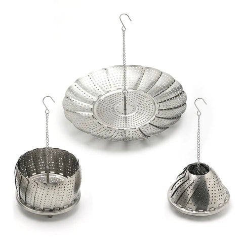 Set of three metal steamer baskets with hanging chains on a white background