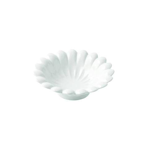 A small white ceramic bowl with a fluted, petal-like rim, shown on a plain white background.