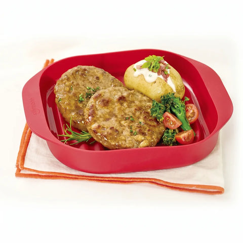 Red food container with meat patties, potato, and vegetables on a white background