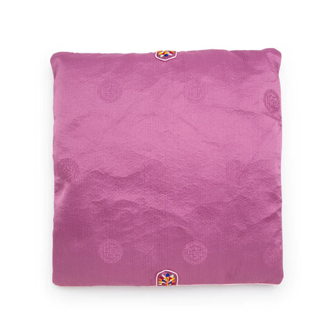 Purple textured square seat cushion with an embroidered design on a white background