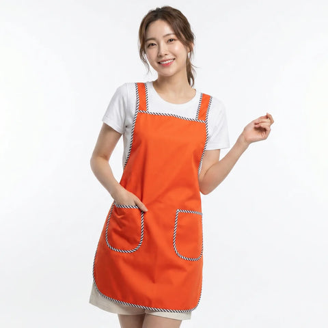 Woman wearing an orange apron on a white background