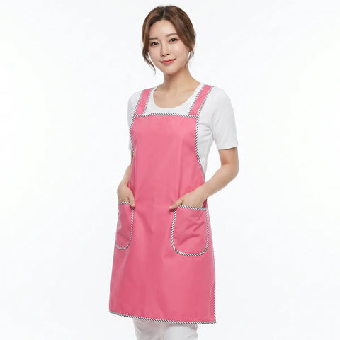Woman wearing a pink apron on a white background