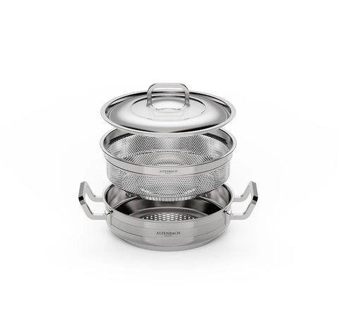 Set of stainless steel cookware with different components on a white background