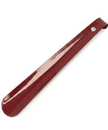 Red shoe horn on a white background