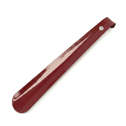 Red shoe horn on a white background