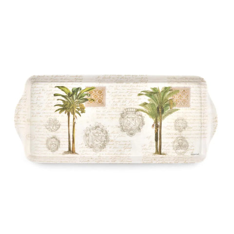 A rectangular decorative tray with rounded corners and side handles, featuring two illustrated palm trees, ornate medallions, and faint cursive script on a warm off-white background.