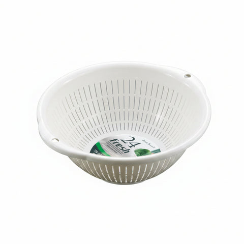 A white plastic colander bowl with vertical slits and two side handles, shown on a smooth gray gradient background. The inside bottom features a circular paper label with '24 fresh' visible.