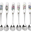 Set of six floral-patterned spoons with white handles on a white background