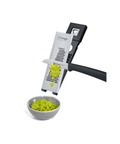 A triangular metal manual spice grater with a black handle, shown grating fresh wasabi into a small white bowl. The Triangle brand logo is visible on the grater.