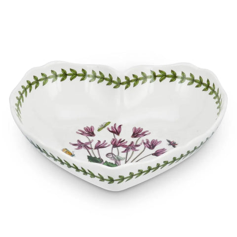 A heart-shaped dish with a floral motif and green ivy border on a white background.