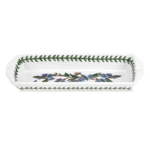 A white rectangular ceramic baking dish with scalloped handles, featuring a green leaf border and a floral pattern of blue forget-me-nots in the center.