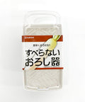 A packaged Japanese mandoline slicer by Nakaya, shown in its clear plastic retail packaging with a white and brown paper label featuring a daikon radish illustration.