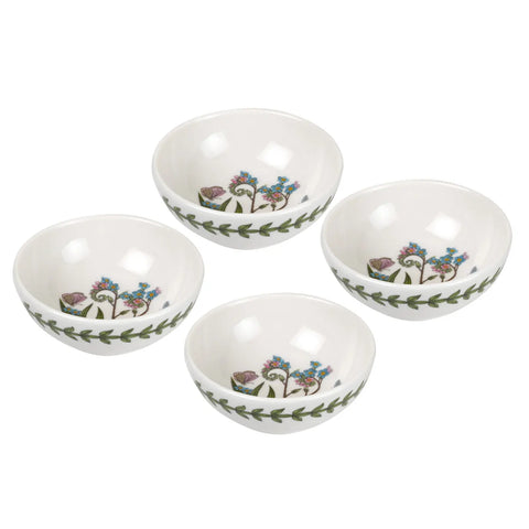 Four white ceramic bowls with a green leaf border and floral pattern inside, arranged on a white background.
