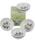 Four white ceramic herb bowls with botanical illustrations and a green Botanics box, arranged on a white background.