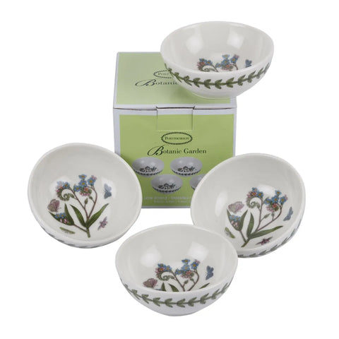 Four white ceramic herb bowls with botanical illustrations and a green Botanics box, arranged on a white background.