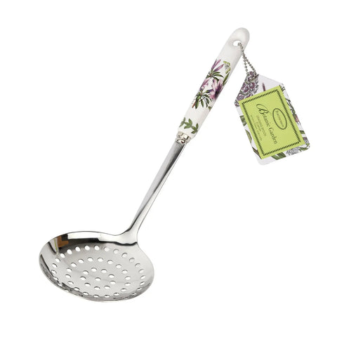 Metallic ladle with floral handle and packaging on a white background