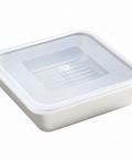 Metal food container with a clear plastic lid on a white background