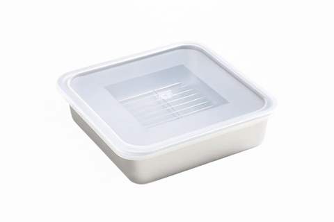 Metal food container with a clear plastic lid on a white background