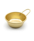 Gold-colored bowl with handle on a white background