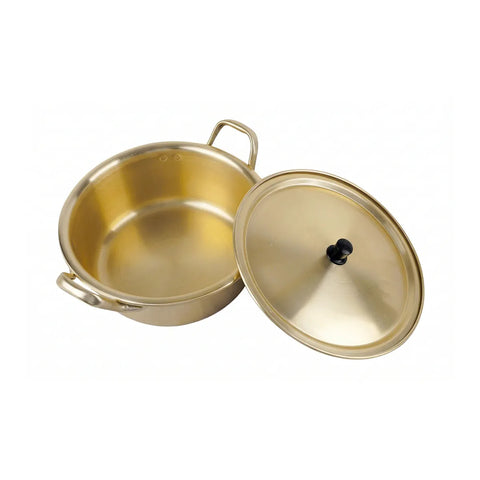 Gold pot with lid on a white background