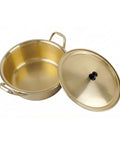 Gold pot with lid on a white background