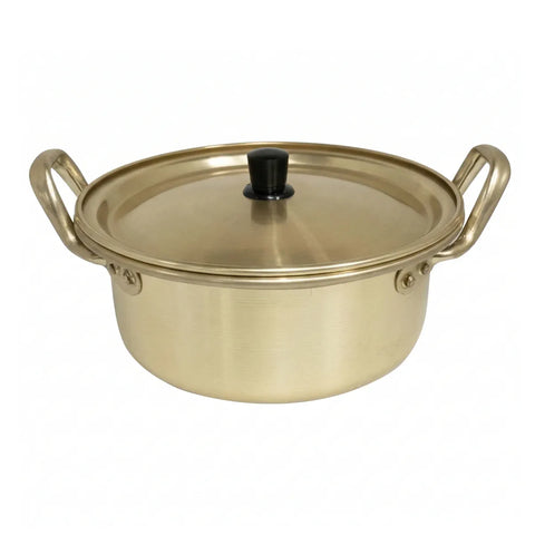 Gold-colored pot with a lid on a white background