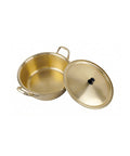 Gold-colored pot with lid on a white background