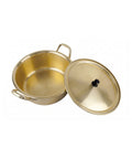 Gold pot with lid on a white background