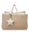 Beige quilted nap bag with a star-shaped pillow on a white background