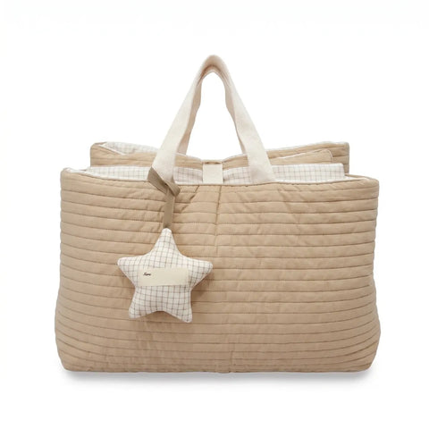 Beige quilted nap bag with a star-shaped pillow on a white background