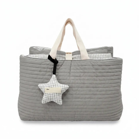 Gray quilted nap bag with a star-shaped pillow on a white background