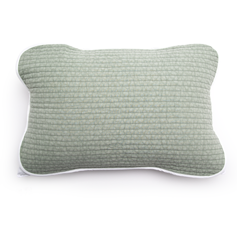 Textured green pillow on a white background