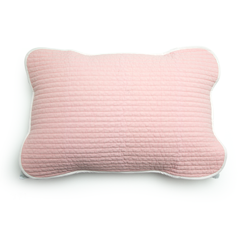 Pink textured pillow on a white background