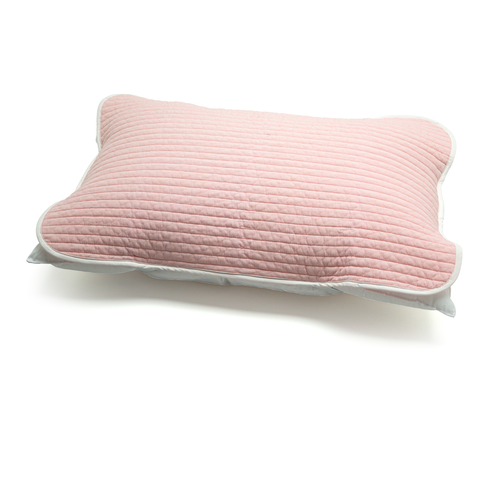 Pink quilted pillow on a white background