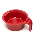 Red plastic spoon holder cup with handle on a white background