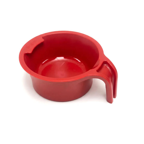 Red plastic spoon holder cup with handle on a white background