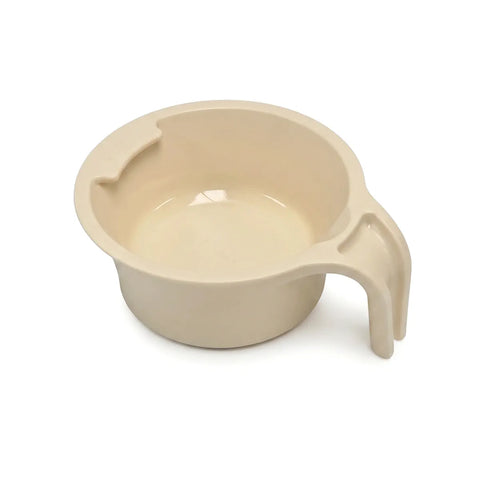 Beige plastic spoon holder cup with handle on a white background
