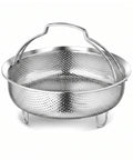 A stainless steel colander basket with a perforated body, a curved handle, and three small legs, shown on a clean white background.